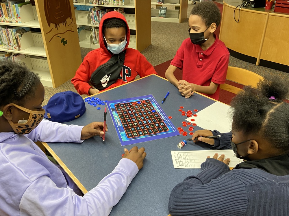 Club members playing a game that develops brain functionality