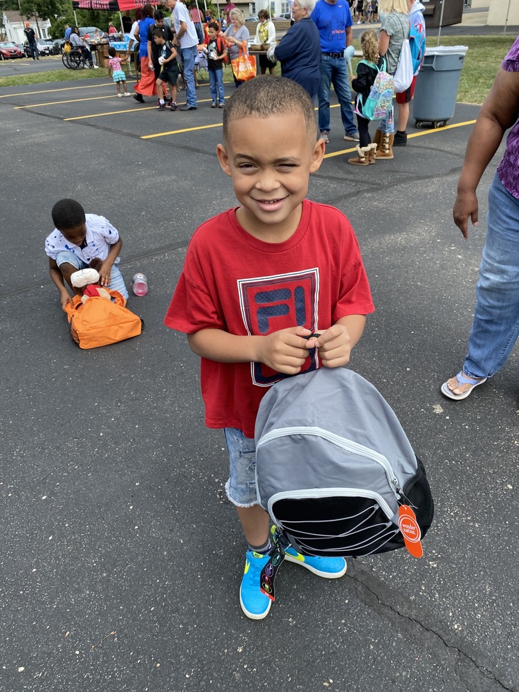 student with new backpack for school