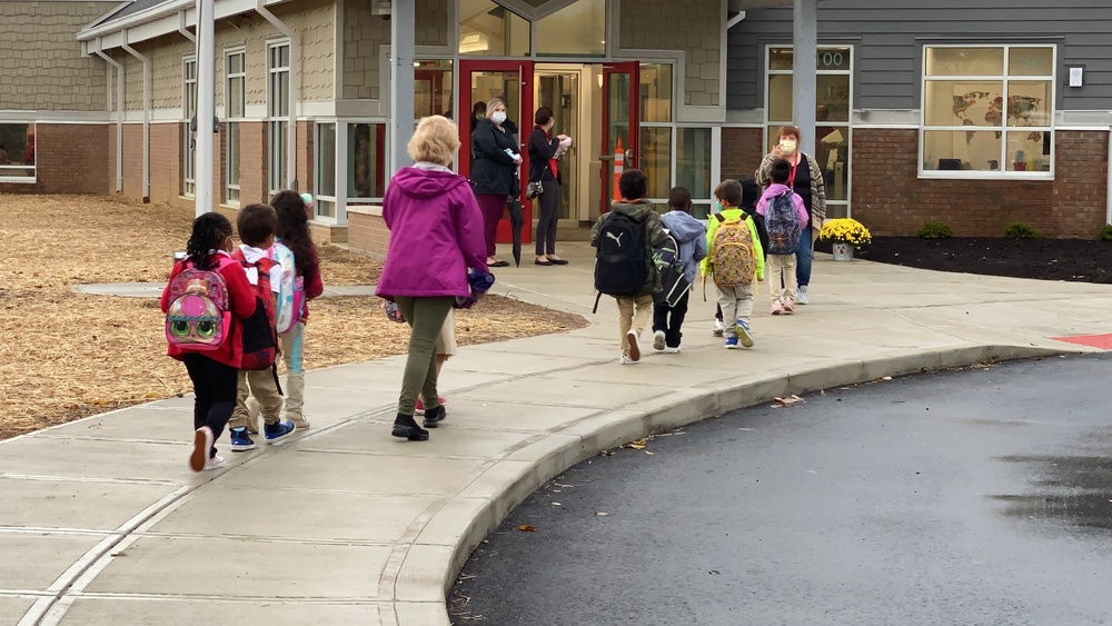 Kindergarten students entering the new Early Learning Center for the first day